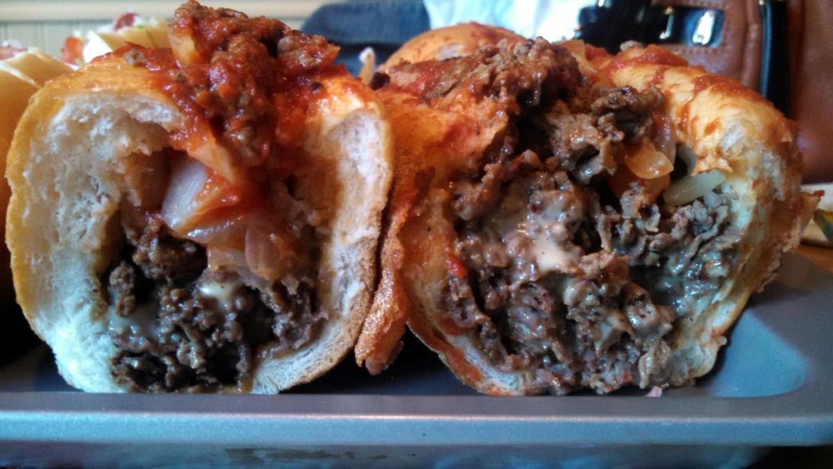 Cheese steaks are stuffed with meat at Ray’s Pizzeria & Steaks. Order it with sweet red sauce. / Courtesy of 22ndandphilly.com